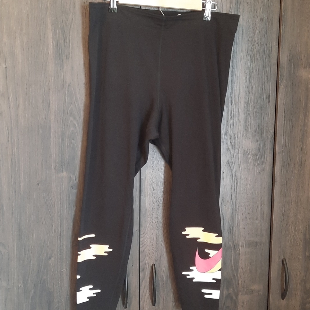 Black Nike leggings with fun hot pink swoosh